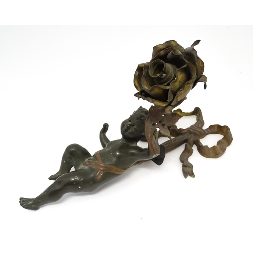 1421 - A cast bronze wall light sconce modelled as a cherub holding aloft a scrolling flower. Approx. 12