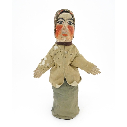 942 - Toy: A 19thC French glove puppet with wooden head and hands and hand painted features. Approx. 18