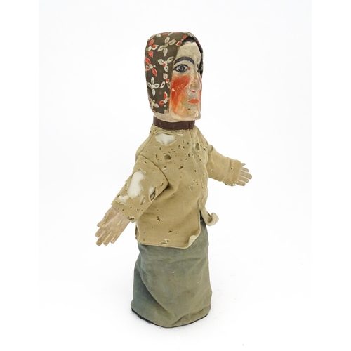 942 - Toy: A 19thC French glove puppet with wooden head and hands and hand painted features. Approx. 18