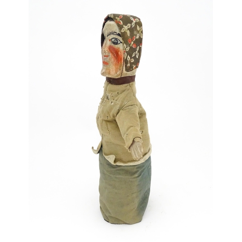 942 - Toy: A 19thC French glove puppet with wooden head and hands and hand painted features. Approx. 18