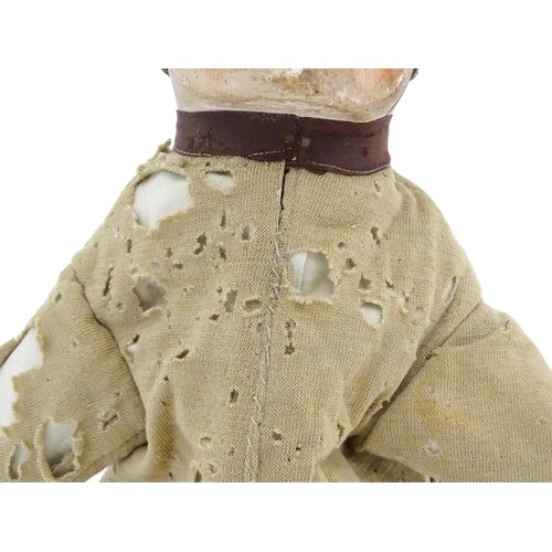 942 - Toy: A 19thC French glove puppet with wooden head and hands and hand painted features. Approx. 18