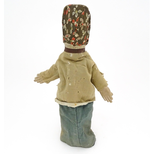 942 - Toy: A 19thC French glove puppet with wooden head and hands and hand painted features. Approx. 18