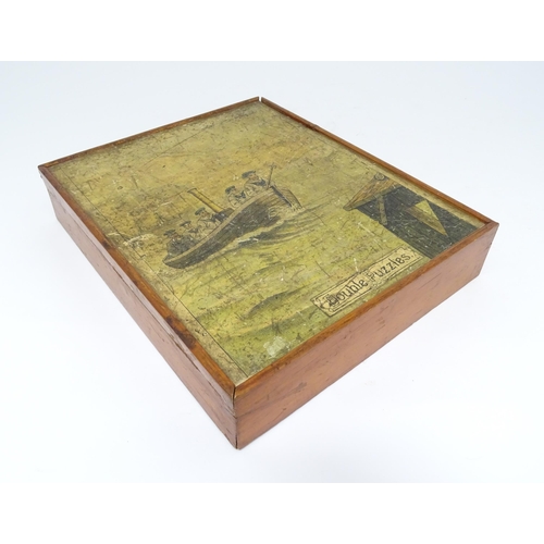 946 - A vintage wooden jigsaw puzzle tilted Double Puzzles, the double sided pieces depicting marine / mar... 