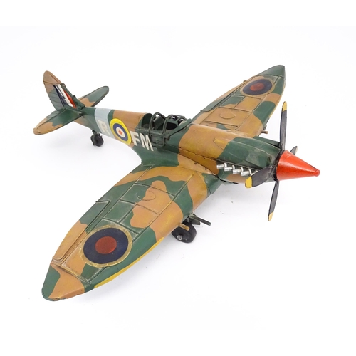 948 - A 20thC scratch built tin plate scale model of a spitfire. Approx. 18