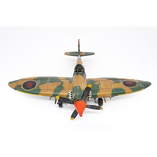 948 - A 20thC scratch built tin plate scale model of a spitfire. Approx. 18