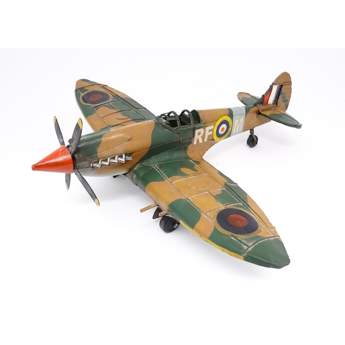 948 - A 20thC scratch built tin plate scale model of a spitfire. Approx. 18