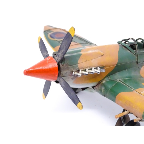 948 - A 20thC scratch built tin plate scale model of a spitfire. Approx. 18