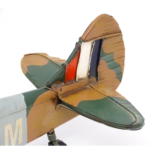 948 - A 20thC scratch built tin plate scale model of a spitfire. Approx. 18