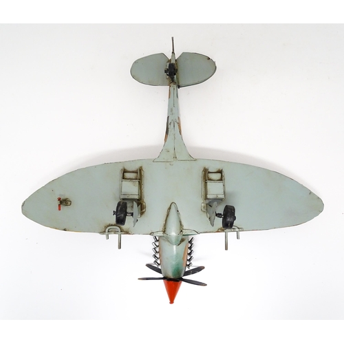 948 - A 20thC scratch built tin plate scale model of a spitfire. Approx. 18