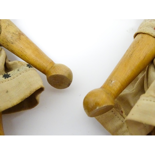 949 - Toys: Two vintage Continental wooden peg dolls with painted features. Approx. 7 1/4