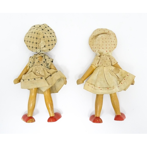 949 - Toys: Two vintage Continental wooden peg dolls with painted features. Approx. 7 1/4