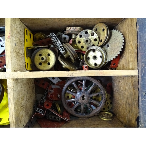 962 - Toys: A quantity of assorted Meccano parts to include flat plates, girders, wheels, and tools