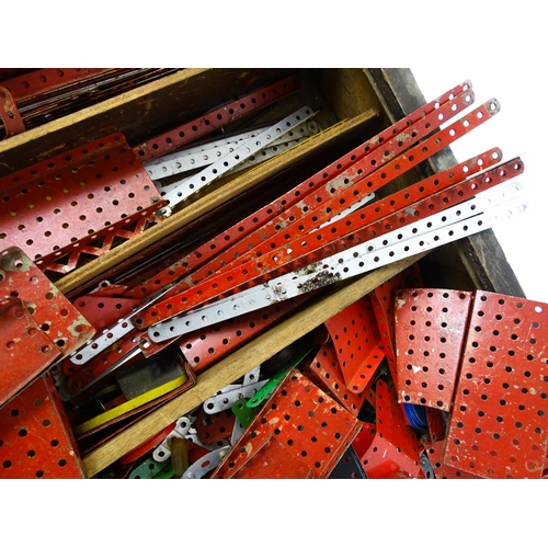 962 - Toys: A quantity of assorted Meccano parts to include flat plates, girders, wheels, and tools