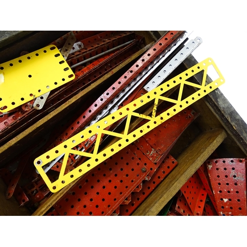 962 - Toys: A quantity of assorted Meccano parts to include flat plates, girders, wheels, and tools