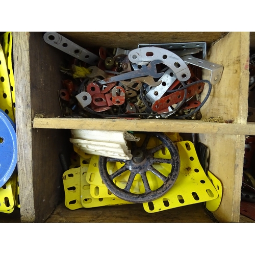 962 - Toys: A quantity of assorted Meccano parts to include flat plates, girders, wheels, and tools