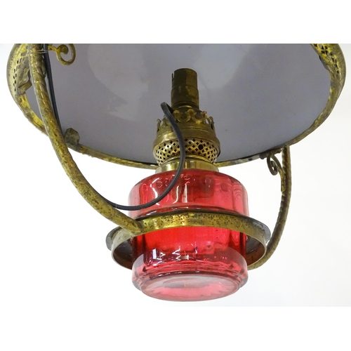 1409 - A Hinks & Son hanging pendant oil lamp. Together with another. Largest approx. 18