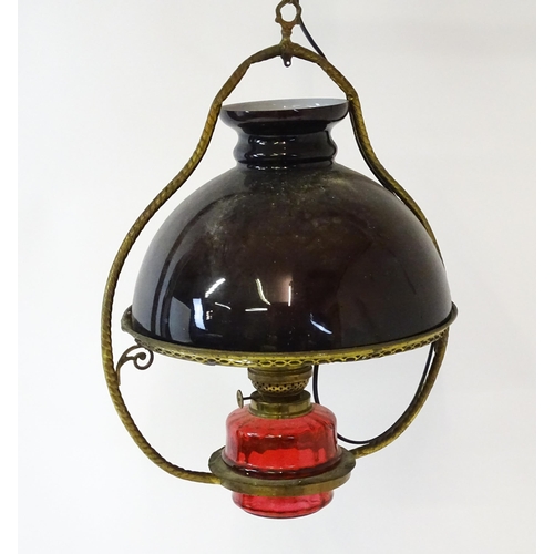 1409 - A Hinks & Son hanging pendant oil lamp. Together with another. Largest approx. 18