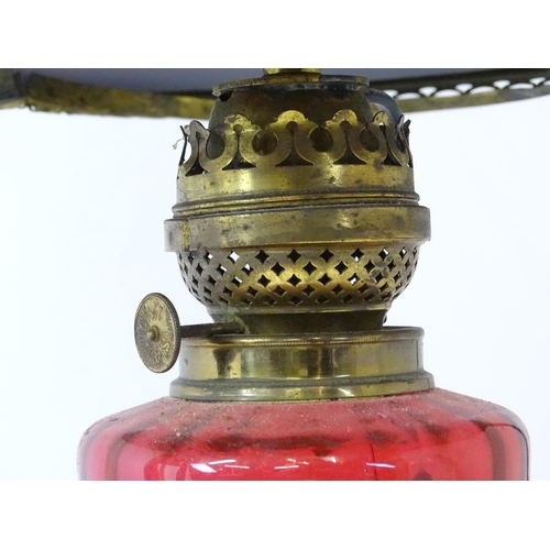 1409 - A Hinks & Son hanging pendant oil lamp. Together with another. Largest approx. 18