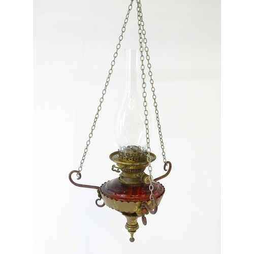 1409 - A Hinks & Son hanging pendant oil lamp. Together with another. Largest approx. 18