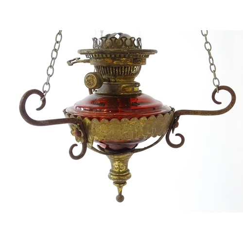 1409 - A Hinks & Son hanging pendant oil lamp. Together with another. Largest approx. 18