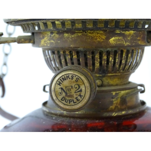 1409 - A Hinks & Son hanging pendant oil lamp. Together with another. Largest approx. 18