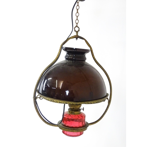 1409 - A Hinks & Son hanging pendant oil lamp. Together with another. Largest approx. 18