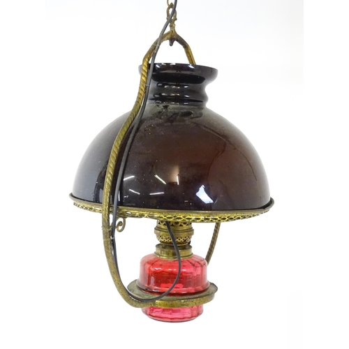 1409 - A Hinks & Son hanging pendant oil lamp. Together with another. Largest approx. 18