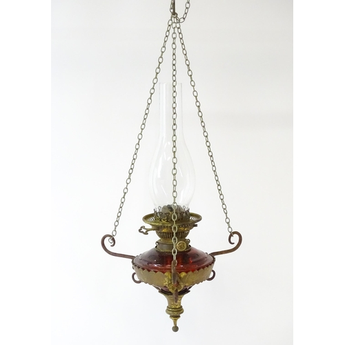 1409 - A Hinks & Son hanging pendant oil lamp. Together with another. Largest approx. 18