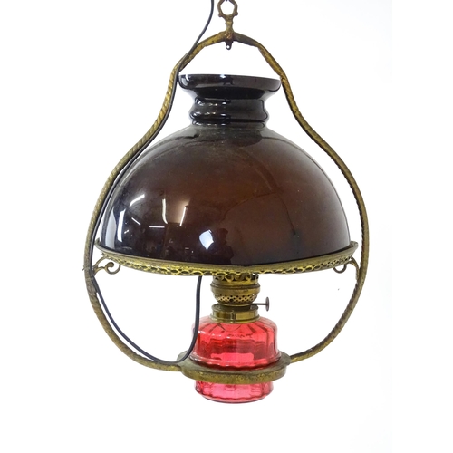 1409 - A Hinks & Son hanging pendant oil lamp. Together with another. Largest approx. 18