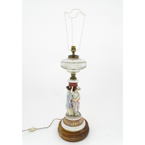 1411 - A table lamp formed from an oil lamp with ceramic figural base. Approx. 22