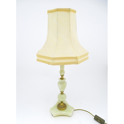 1414 - A 20thC table lamp with onyx style turned base. Approx. 18