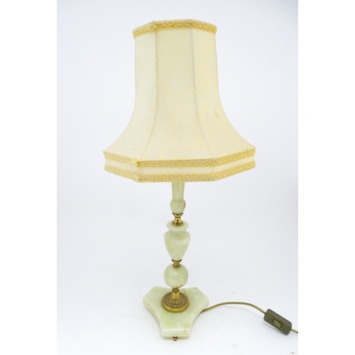 1414 - A 20thC table lamp with onyx style turned base. Approx. 18