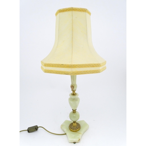 1414 - A 20thC table lamp with onyx style turned base. Approx. 18