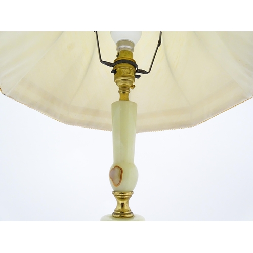 1414 - A 20thC table lamp with onyx style turned base. Approx. 18