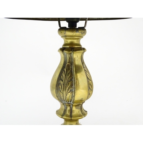 1422 - A 20thC brass table lamp with foliate detail and brass domed shade. Approx. 17