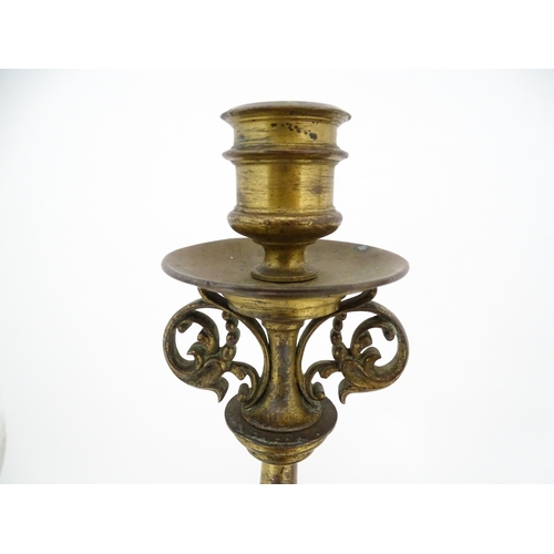 1423 - A pair of 19thC Continental cast brass tall candlesticks with figural, lions mask and foliate detail... 