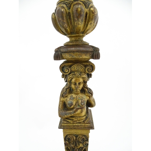 1423 - A pair of 19thC Continental cast brass tall candlesticks with figural, lions mask and foliate detail... 