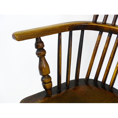 1500 - A mid 19thC ash and elm Windsor chair with a double bowed backrest and a pierced back splat above a ... 