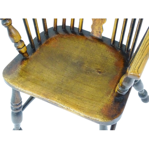 1500 - A mid 19thC ash and elm Windsor chair with a double bowed backrest and a pierced back splat above a ... 