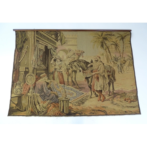 2163 - A 20thC Continental tapestry depicting a Middle Eastern market scene with figures and a street vendo... 