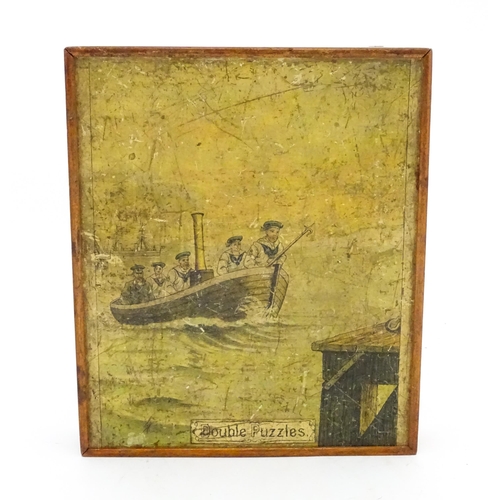 946 - A vintage wooden jigsaw puzzle tilted Double Puzzles, the double sided pieces depicting marine / mar... 