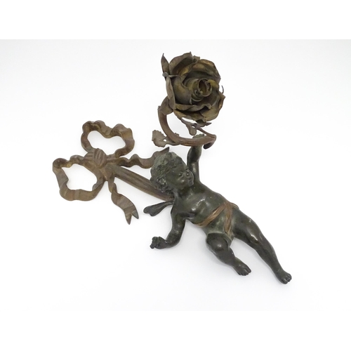 1421 - A cast bronze wall light sconce modelled as a cherub holding aloft a scrolling flower. Approx. 12