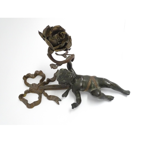 1421 - A cast bronze wall light sconce modelled as a cherub holding aloft a scrolling flower. Approx. 12