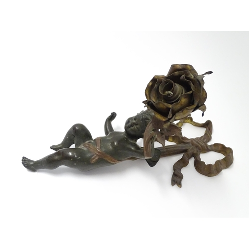 1421 - A cast bronze wall light sconce modelled as a cherub holding aloft a scrolling flower. Approx. 12