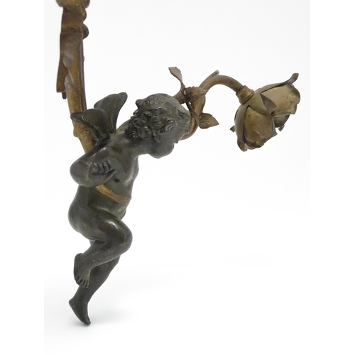 1421 - A cast bronze wall light sconce modelled as a cherub holding aloft a scrolling flower. Approx. 12