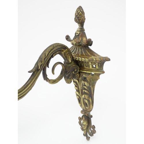 1421A - Two cast wall sconces with urn and rams head detail. Approx. 12