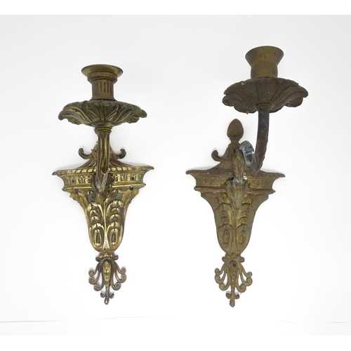 1421A - Two cast wall sconces with urn and rams head detail. Approx. 12