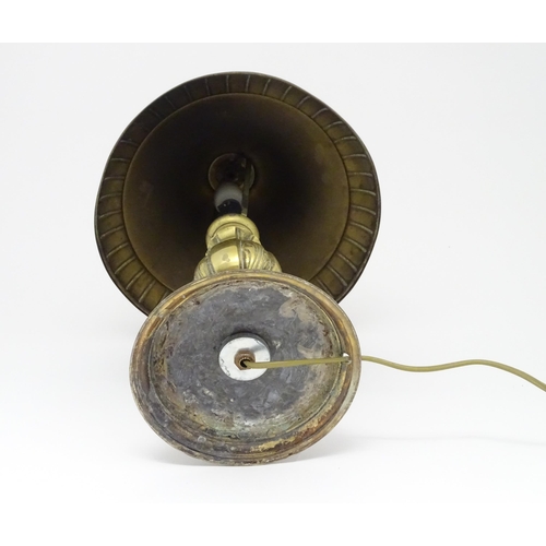 1422 - A 20thC brass table lamp with foliate detail and brass domed shade. Approx. 17