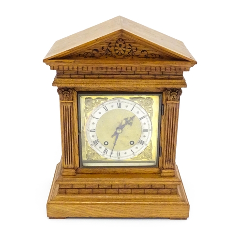 1434 - A 19thC German oak cased mantle clock by Winterhalder & Hofmeier, having a silvered chapter ring, th... 