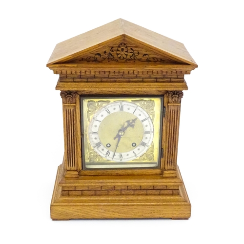 1434 - A 19thC German oak cased mantle clock by Winterhalder & Hofmeier, having a silvered chapter ring, th... 